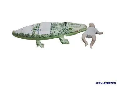 Un cocodrilo y un bebé están sobre un fondo blanco.