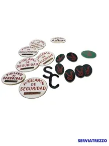 Un montón de botones que dicen vigilante de seguridad