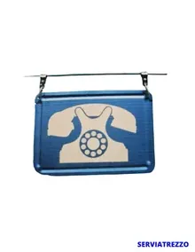 Un cartel azul con la imagen de un teléfono.