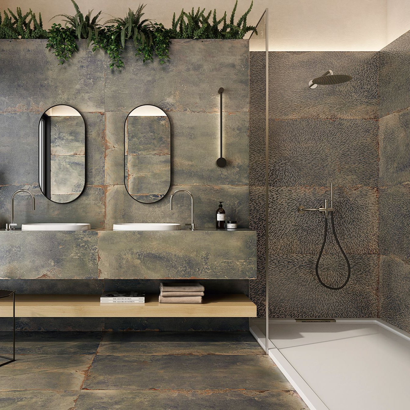 Salle de bains moderne avec des murs en pierre, deux miroirs ovales, une douche et de la verdure en partie haute.