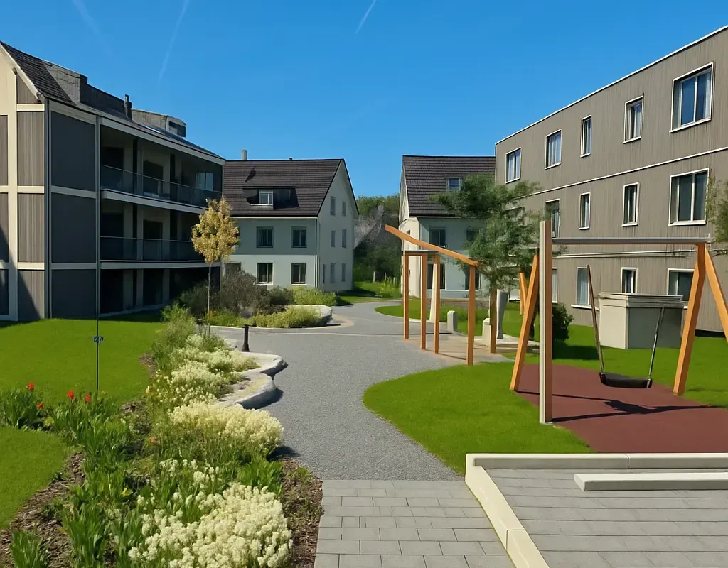 Ein Wohnhof mit Gebäuden, einem Spielplatz und einem geschwungenen Steinweg an einem sonnigen Tag.