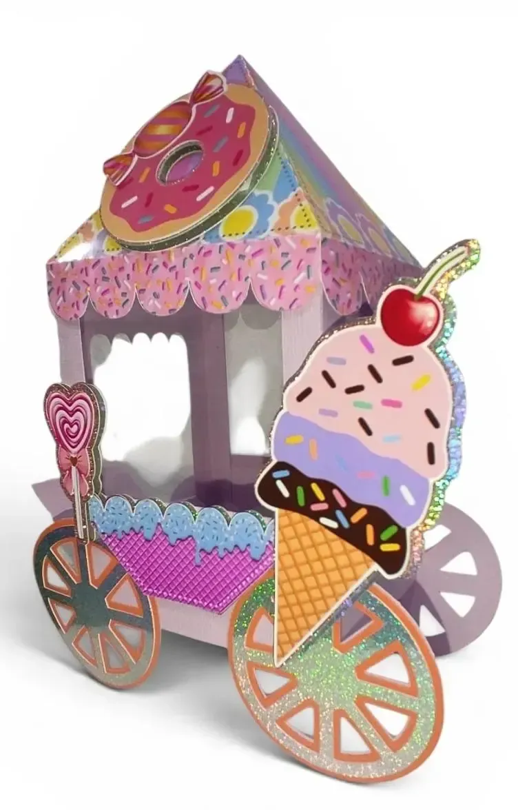 Carrito de helados rosa decorativo con letrero de donut, cono de gofre, cobertura de cereza y detalles de ruedas grandes.