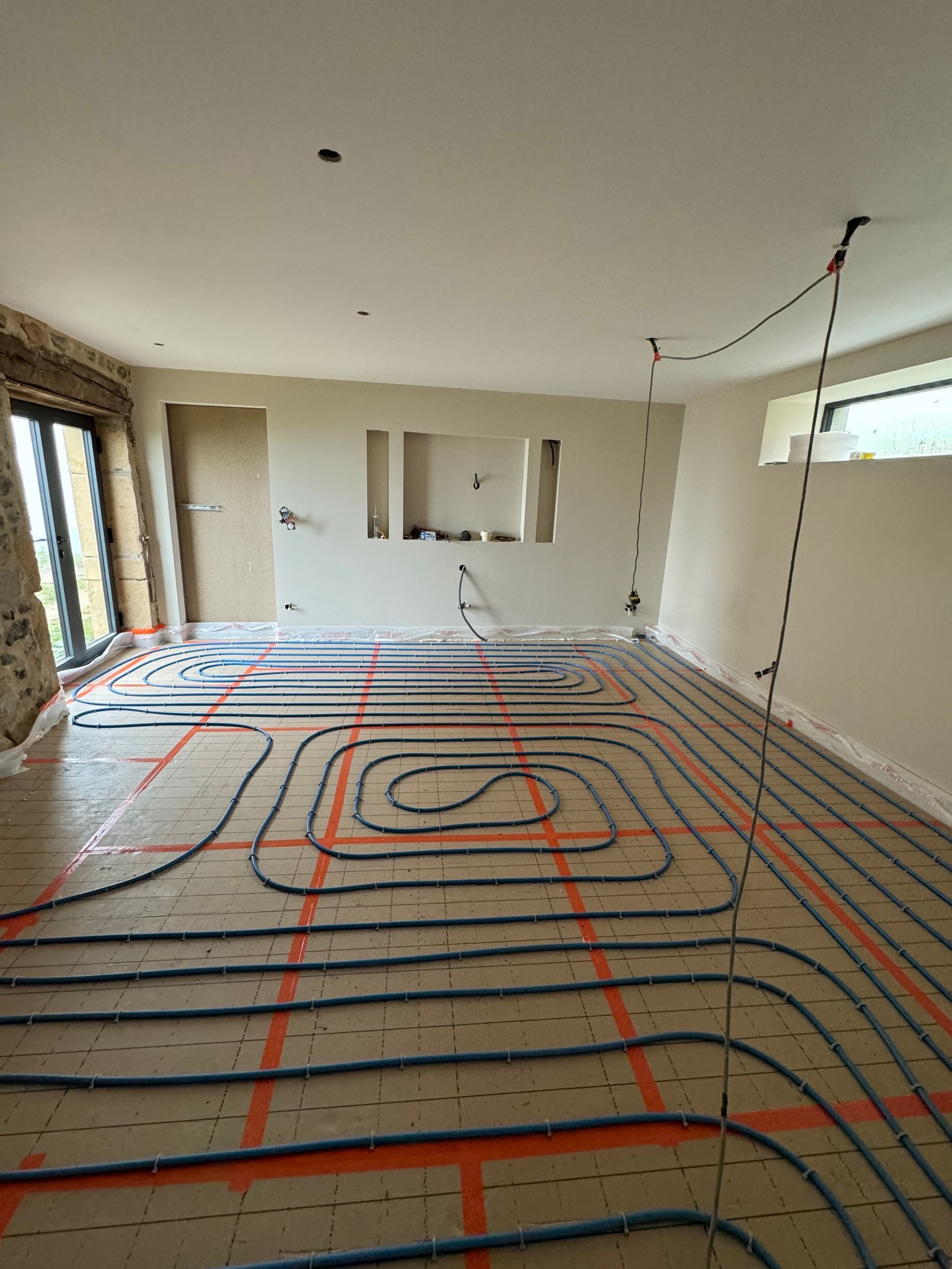 Mise en place d'un plancher chauffant dans une pièce de vie