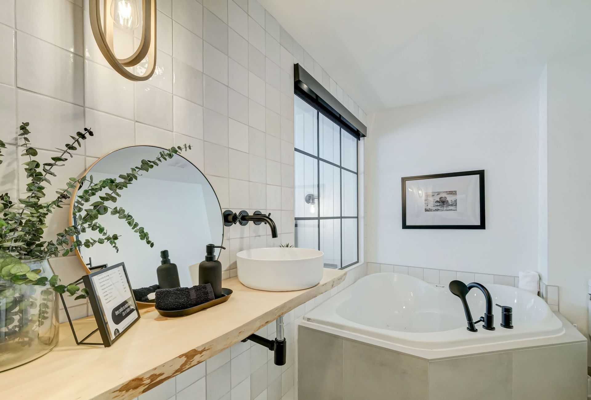 Loft bathroom with corner jetted tub and vanity