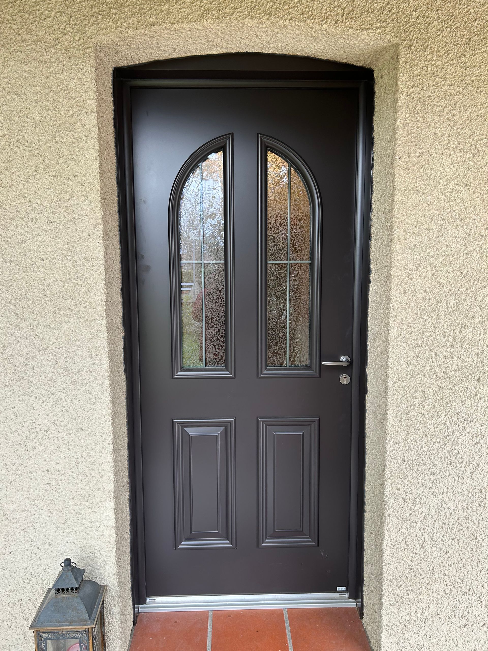 Porte d'entrée avec vitre de style traditionnel