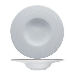 Cuenco para servir blanco, redondo y poco profundo con textura de círculos concéntricos en el borde.