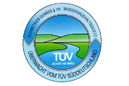 Ein blau-weißer Kreis mit dem Wort TÜV darauf