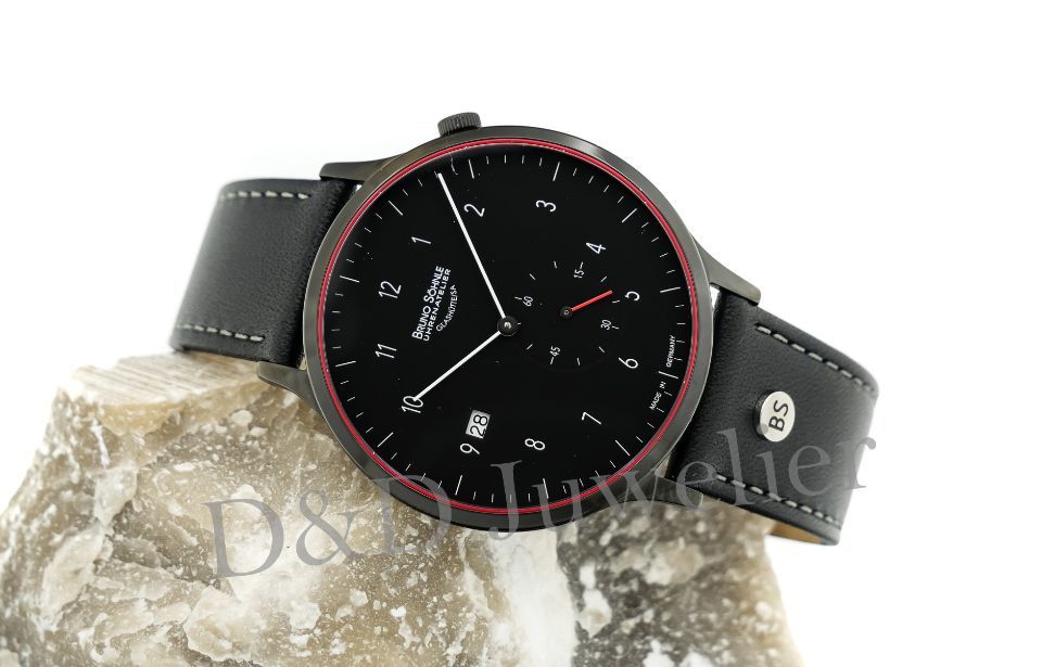 Elegante Armbanduhr mit Lederarmband und dunklem Zifferblatt