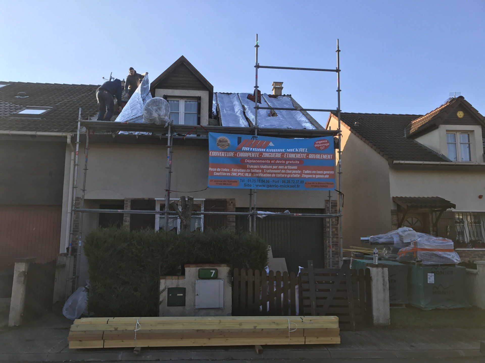 Pose de bâches sur couverture