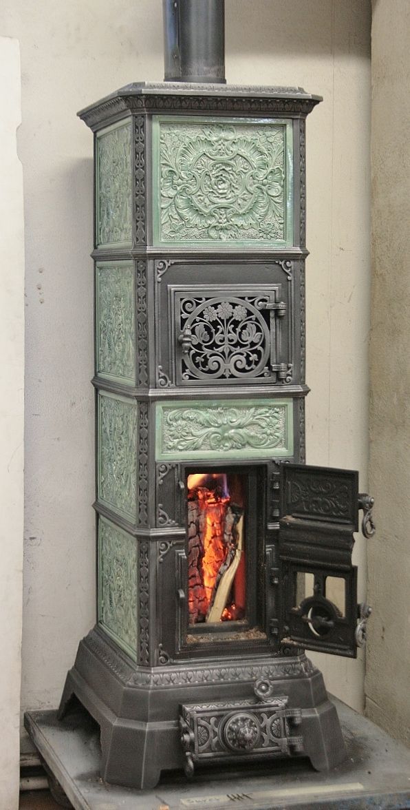 Freestanding tiled stove refurbished with a large fire door - Original external view maintained