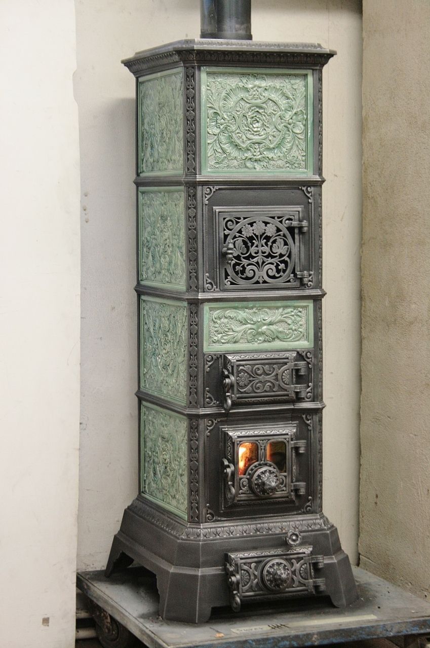 Freestanding tiled stove refurbished with a large fire door - Original external view maintained
