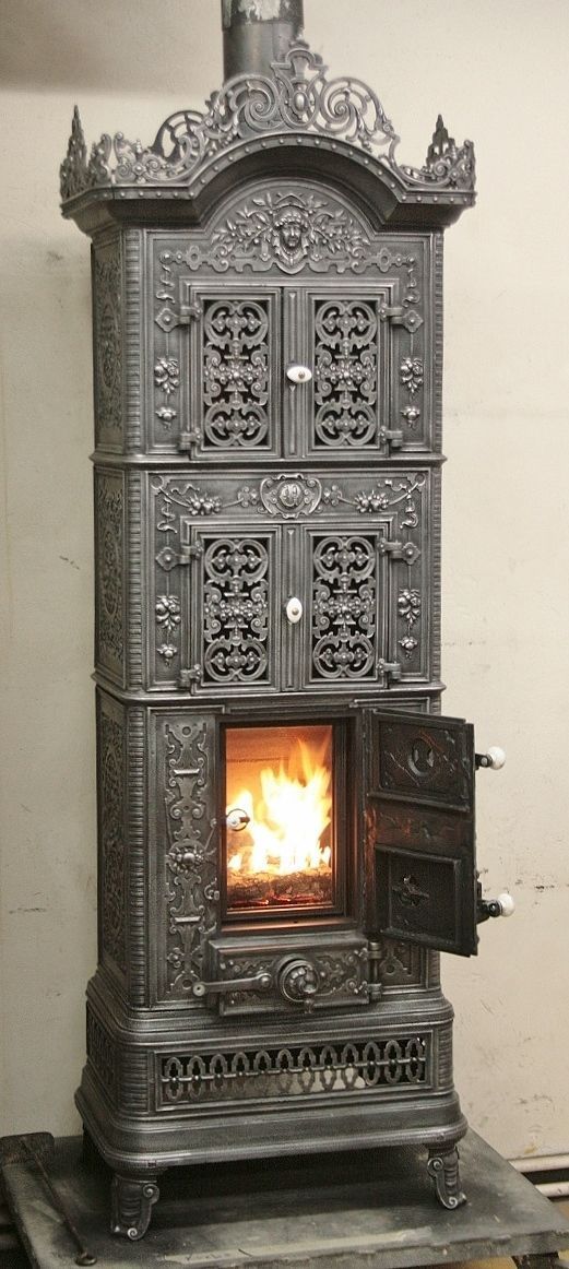 K.K. cast-iron stove with glass doors for a view of the flames
