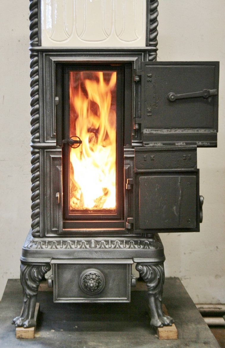 Lucelle stove refurbished with tall, two-part fire door and tall glass door, original view preserved with doors closed