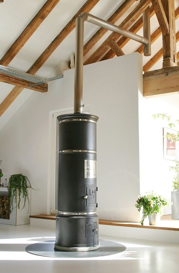 Simple CH cylindrical oven at the heart of a large loft extension