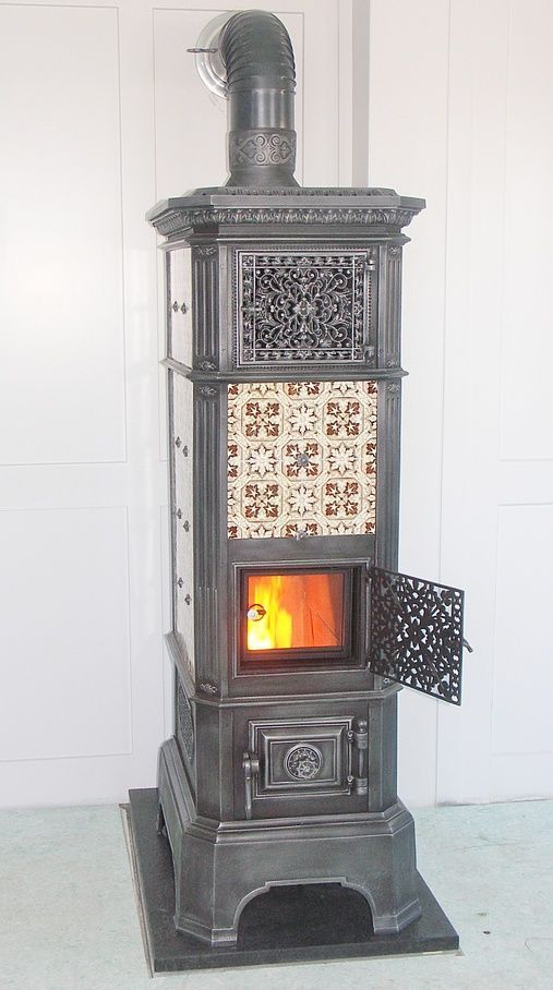 Stove with ceramic tiles with embossed decorations