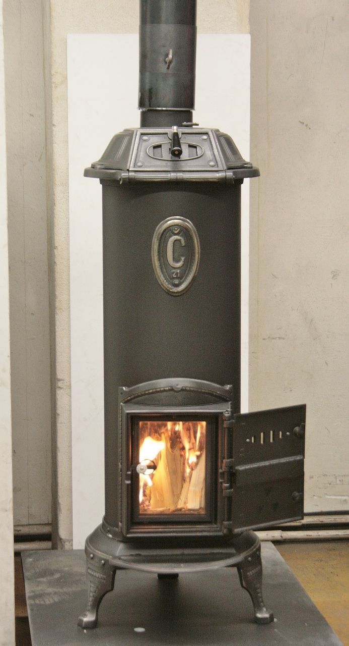 Klus round iron stove refurbished as a standard stove with double fire door and glass door