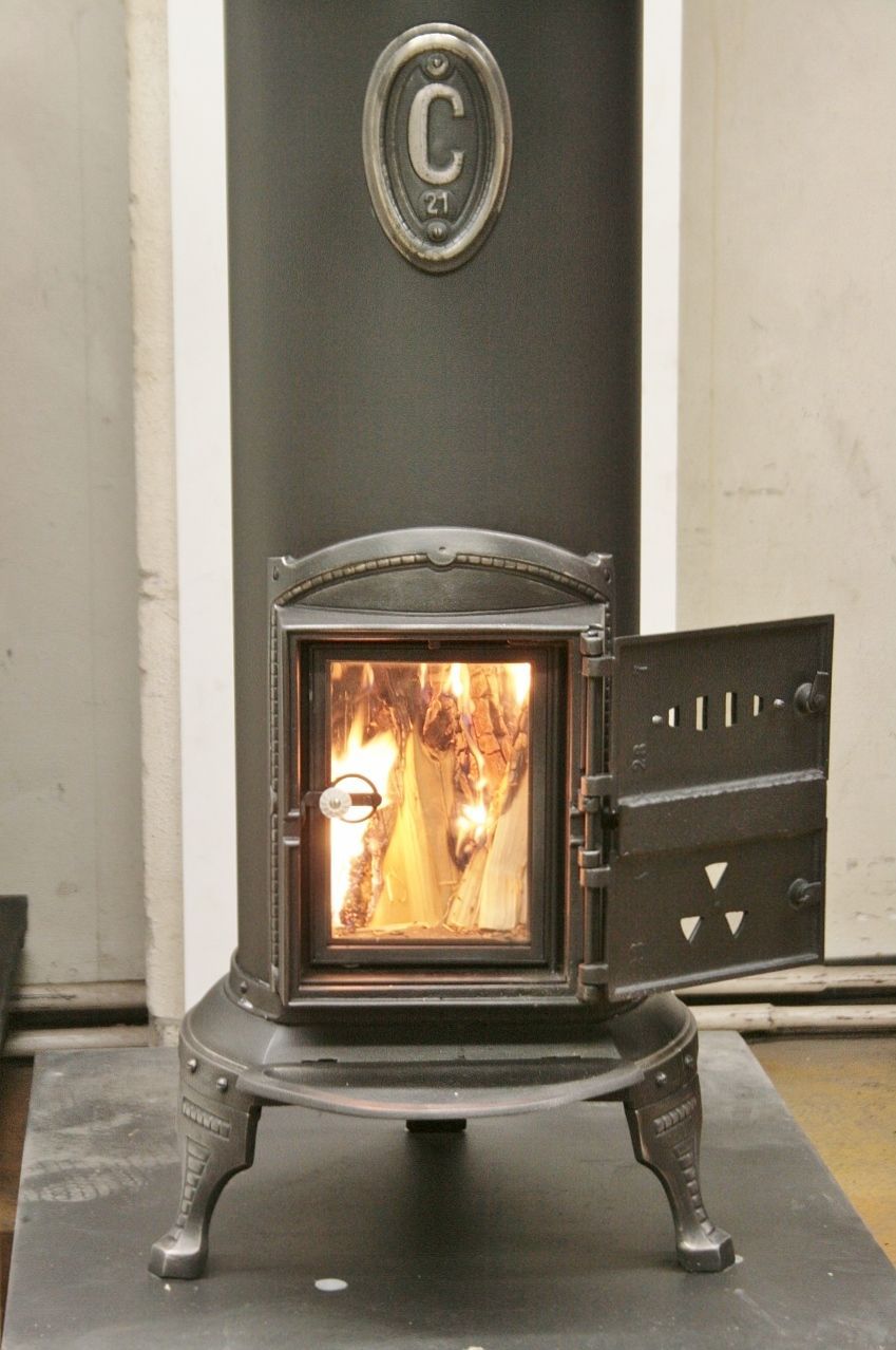 Klus round iron stove refurbished as a standard stove with double fire door and glass door