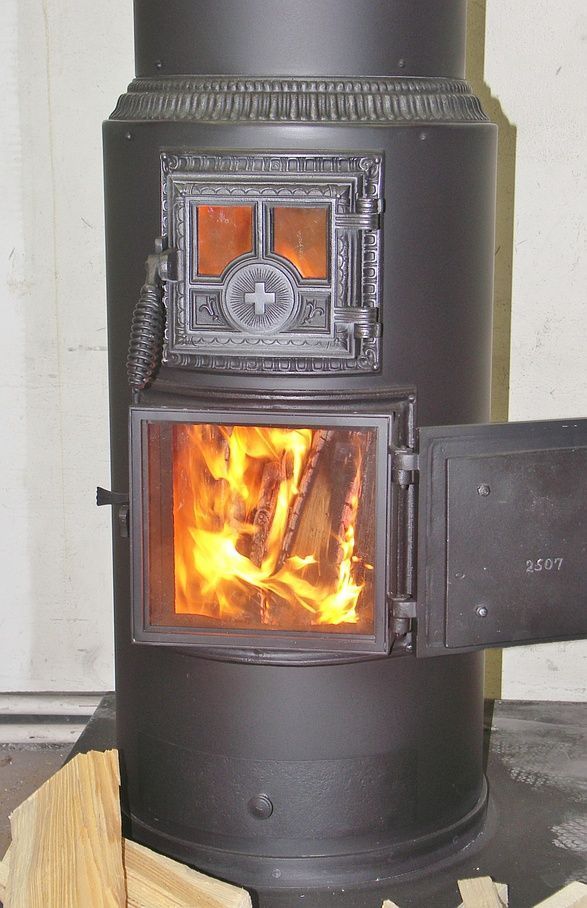 Cylindrical stove with glass door to attach to the lower fire door