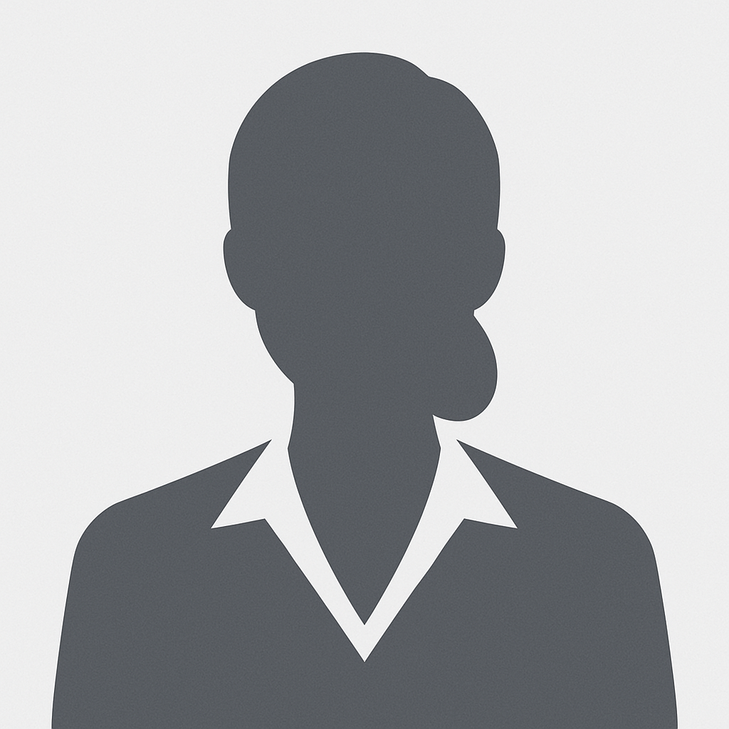 Silhueta de uma mulher vestindo uma camisa de colarinho e com o cabelo preso em um coque.