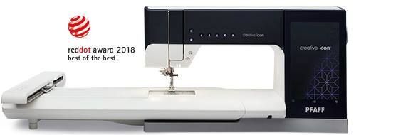 Una máquina de coser con un premio de punto rojo.