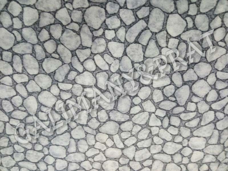 Un primer plano de un patrón de roca gris y blanca.
