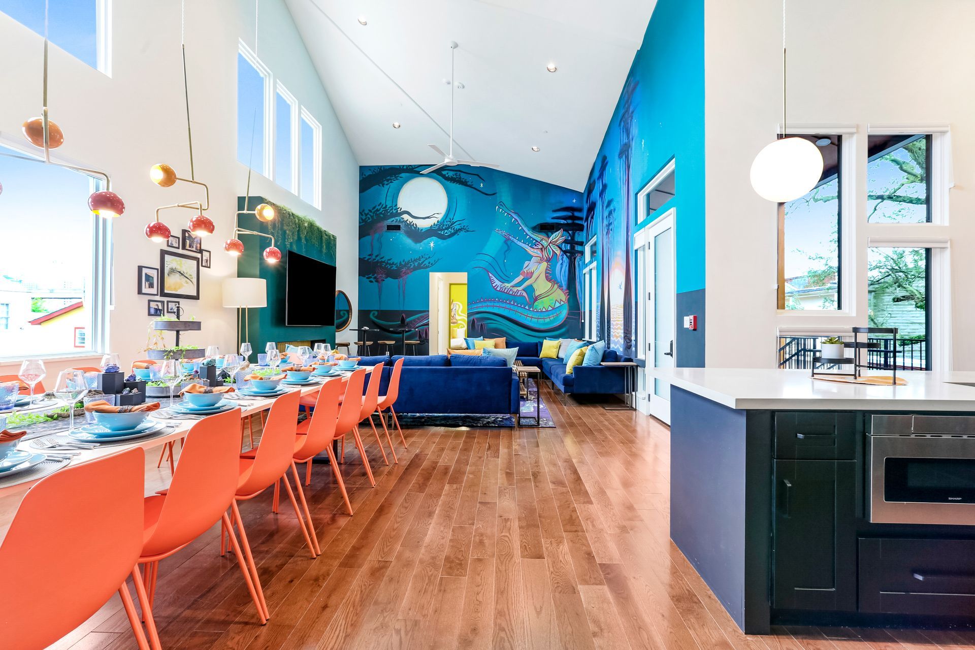 A large room with a dining table and chairs in it.