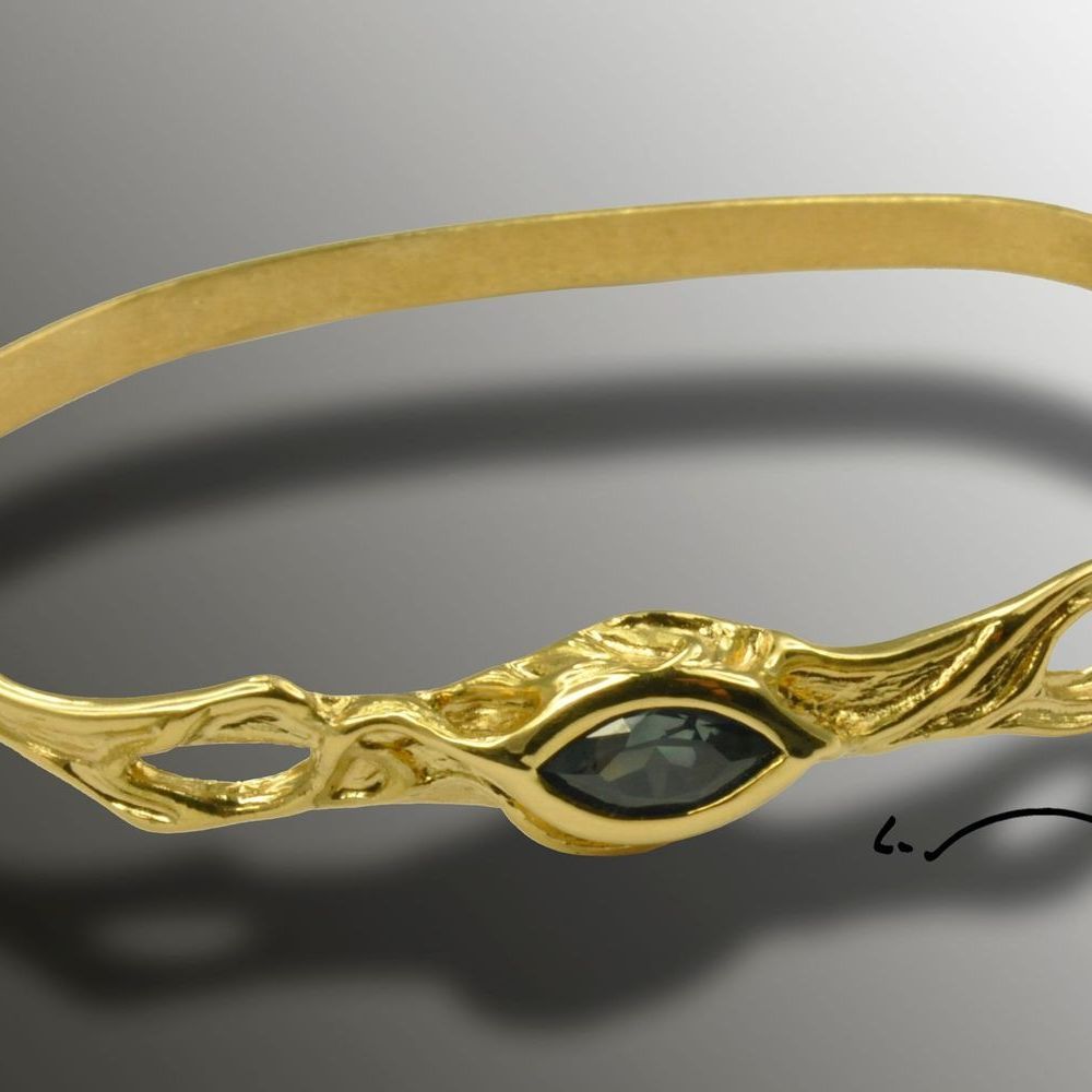 Bracelet en or jaune massif orné d'un saphir