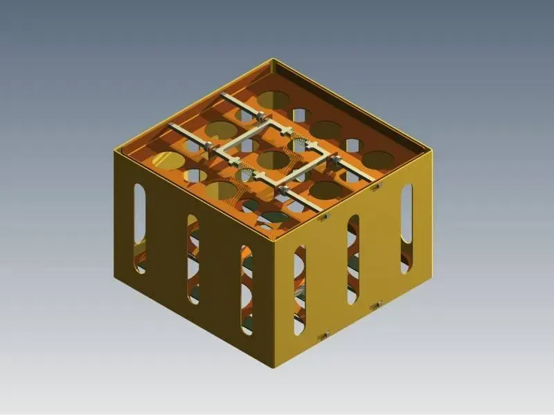 Vue isométrique d'une structure cubique fendue de couleur dorée avec une grille interne et des découpes circulaires.