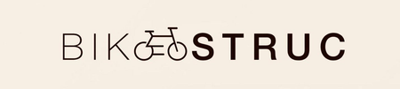 Logotipo de BIK&Oslash;STRUC con una bicicleta integrada en el nombre de la marca sobre un fondo claro.