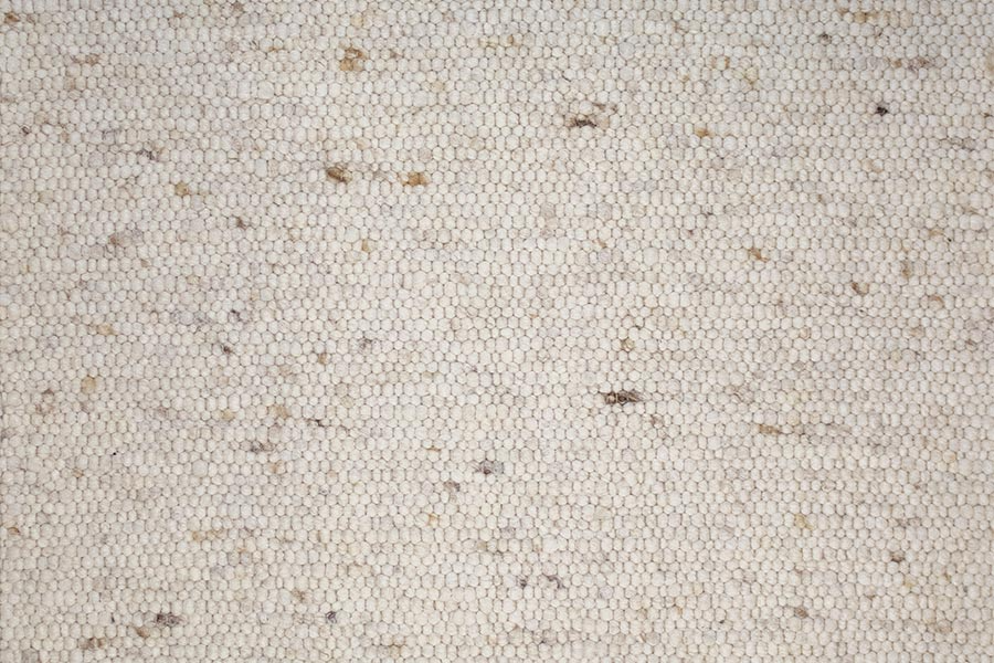 Eine Nahaufnahme eines weißen Teppichs mit Gittermuster.