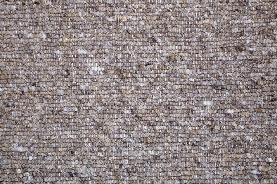 Eine Nahaufnahme einer Backsteinmauer mit vielen kleinen Backsteinen.