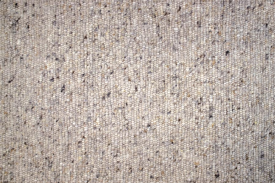 Eine Nahaufnahme einer grauen Teppichstruktur.