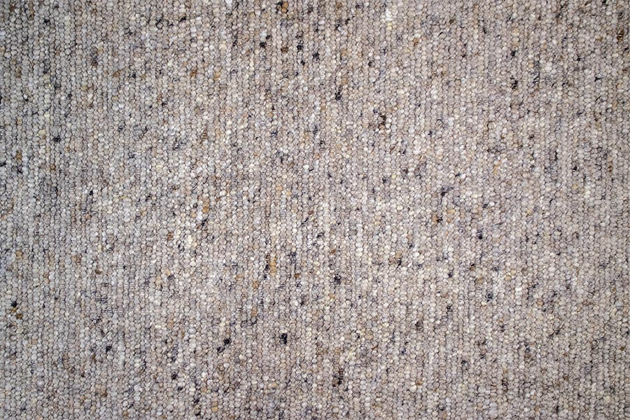 Eine Nahaufnahme einer grauen Teppichstruktur.