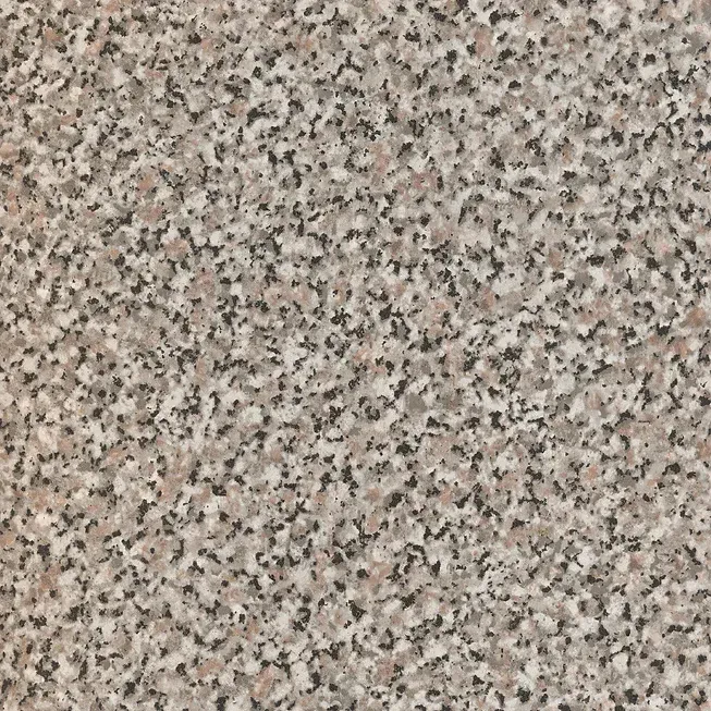 Un primer plano de una encimera de granito con una textura granulada.