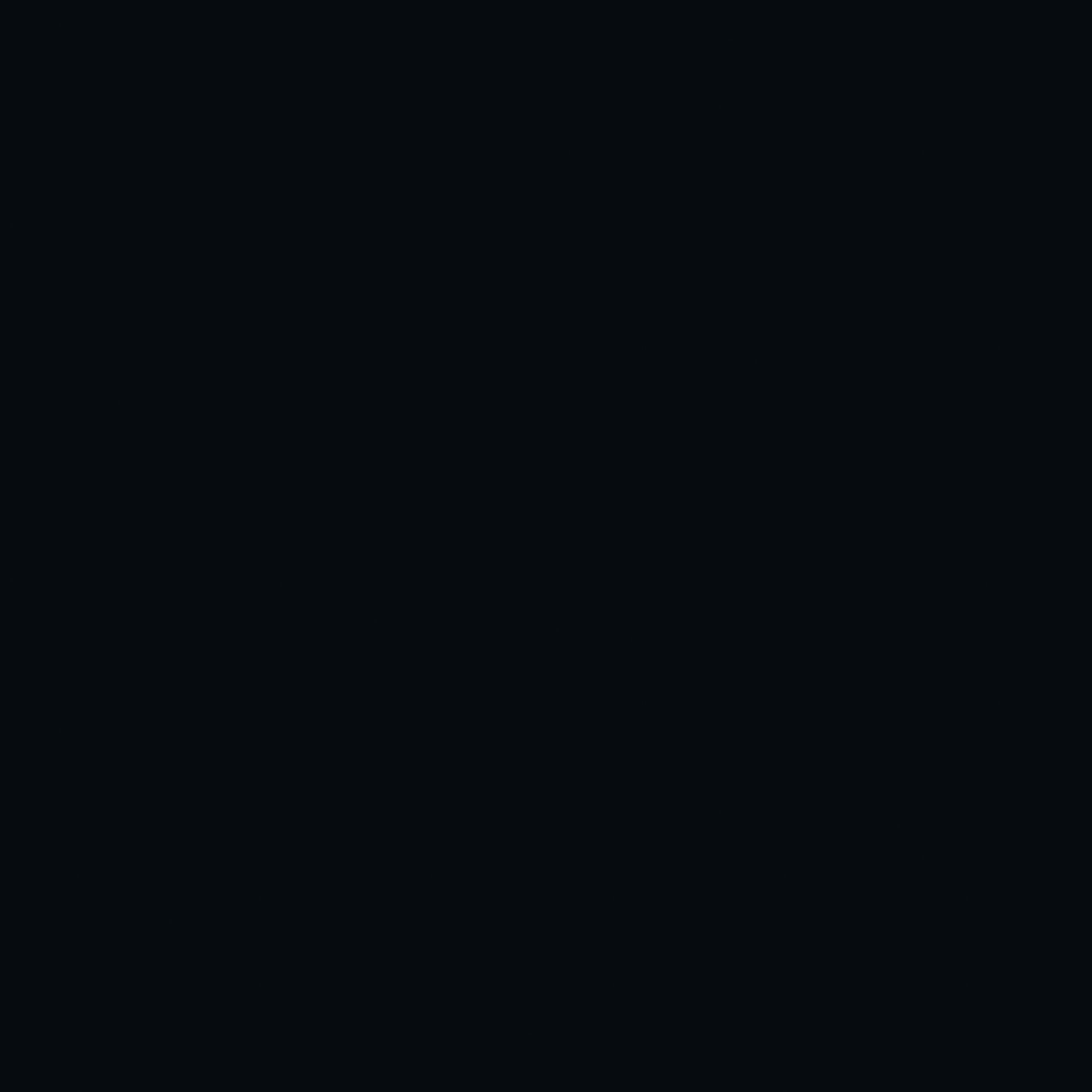 Un fondo negro con algunos puntos blancos.
