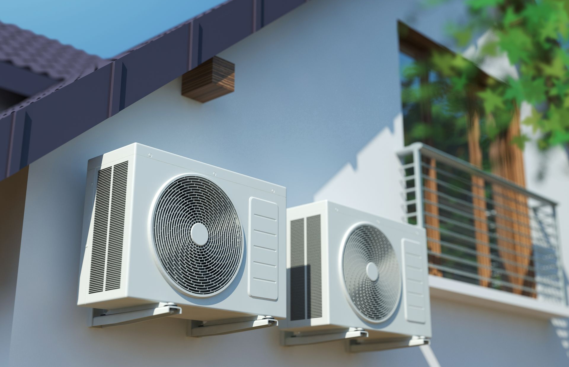 Deux unités de climatisation extérieures installées sur le mur d’un bâtiment, à côté d’une balustrade de balcon.