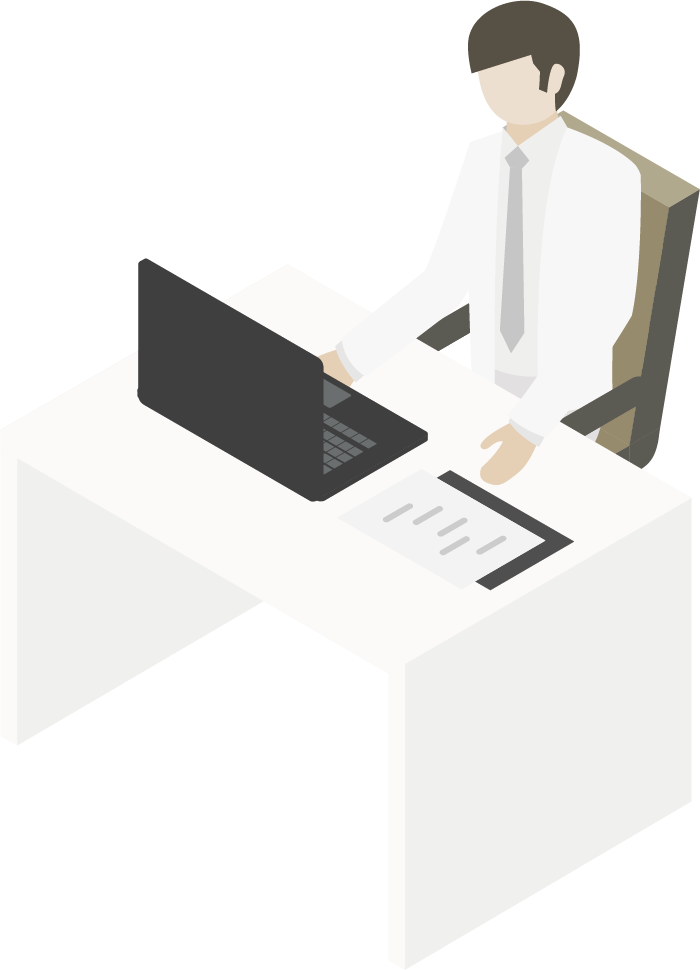 Una persona vestida de manera profesional está sentada en un escritorio trabajando en una computadora portátil 