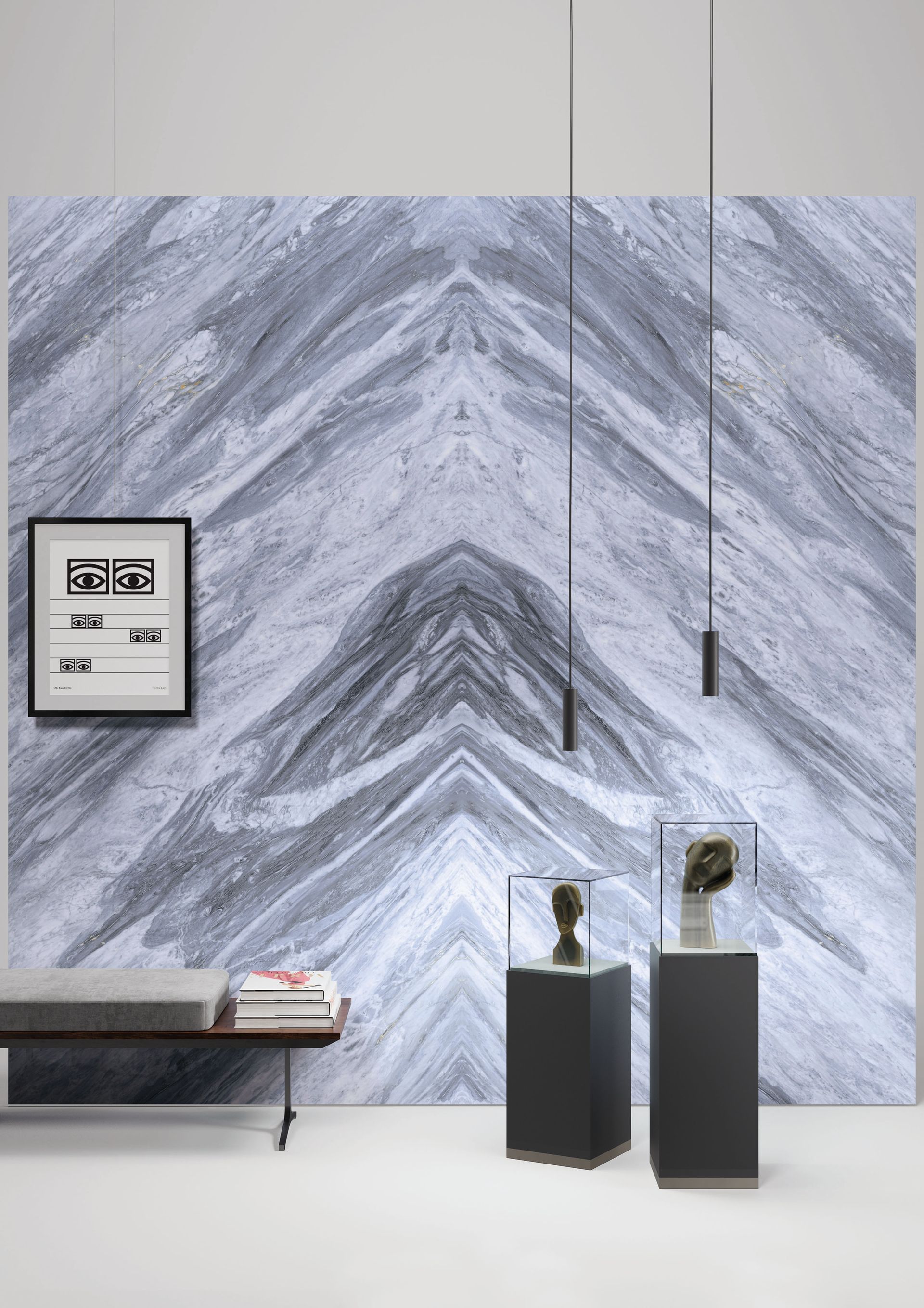 Pièce moderne et minimaliste avec mur en marbre gris, banc, œuvres d'art encadrées, suspensions lumineuses et sculptures sur piédestal.