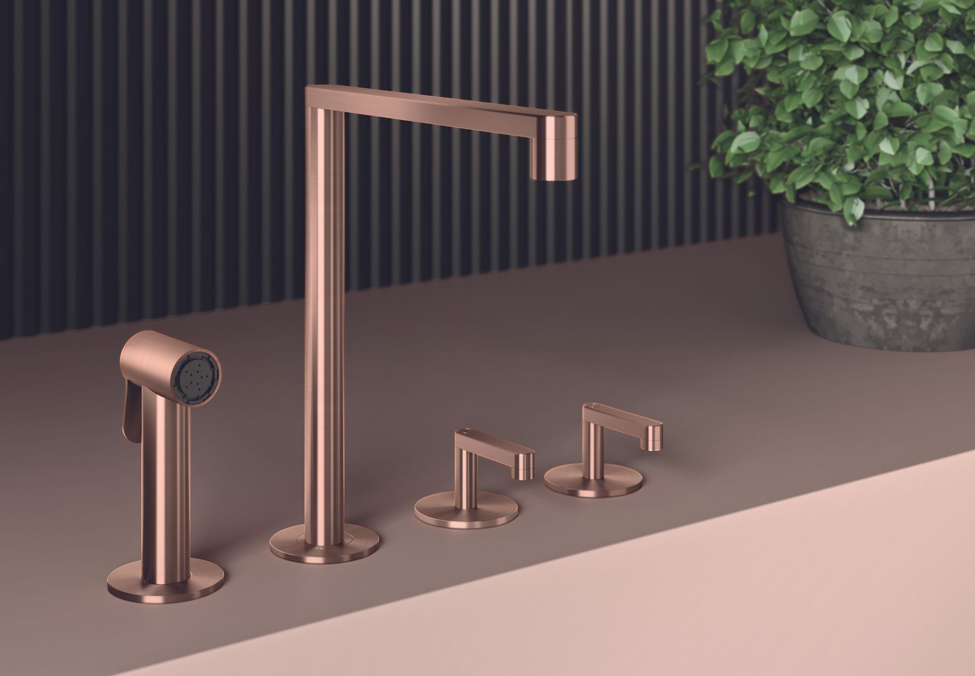 Différents modèles de robinets en or rose sont présentés sur un comptoir à côté d'une plante en pot.