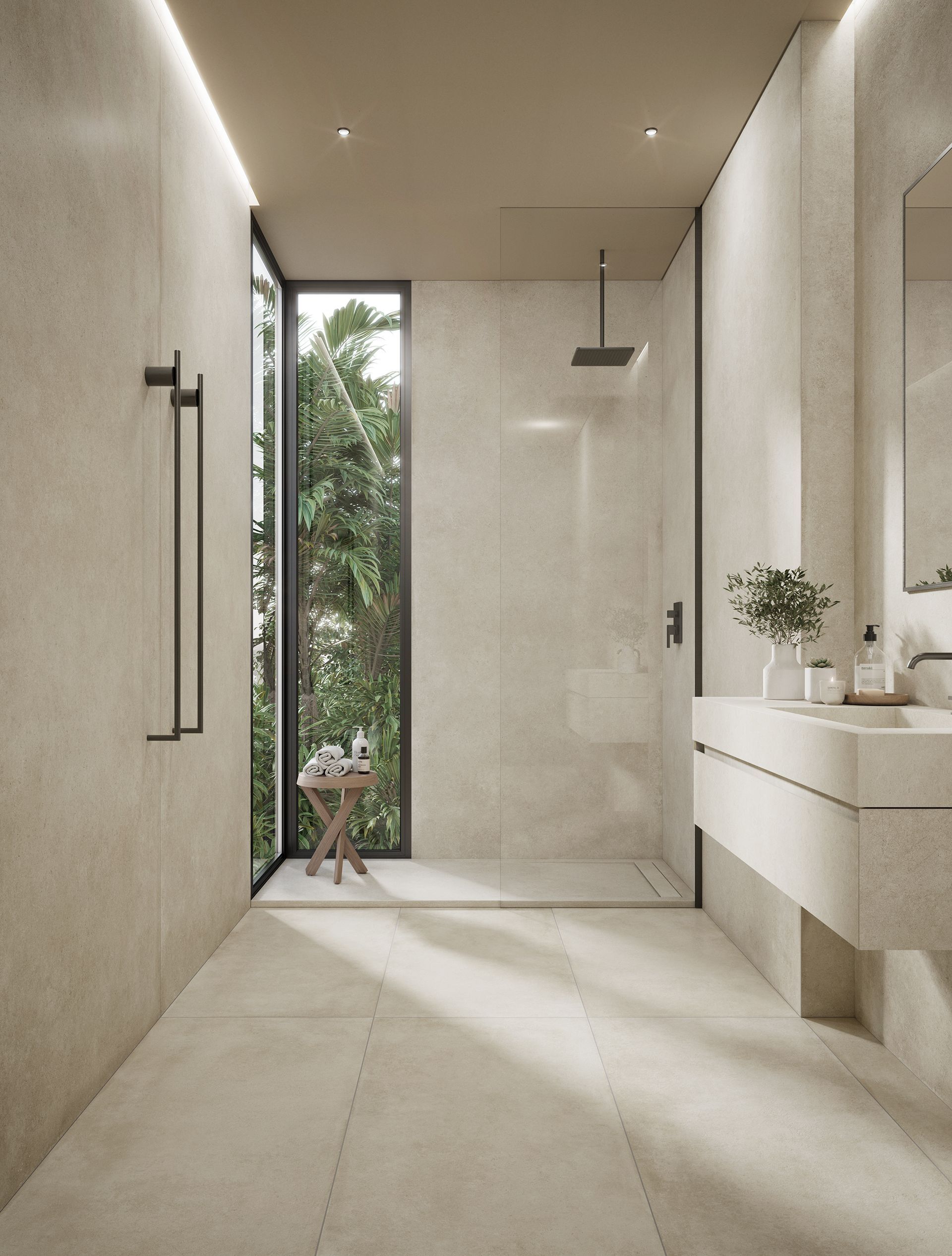 Salle de bains minimaliste beige avec douche à l'italienne, meuble-lavabo et une grande fenêtre donnant sur la verdure.