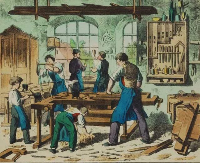 Des personnes travaillant dans un atelier avec des outils de menuiserie et des établis.