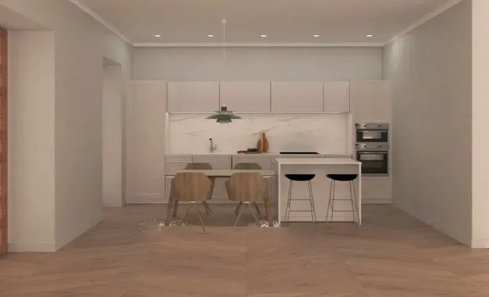 Una cocina con gabinetes blancos y sillas de madera.