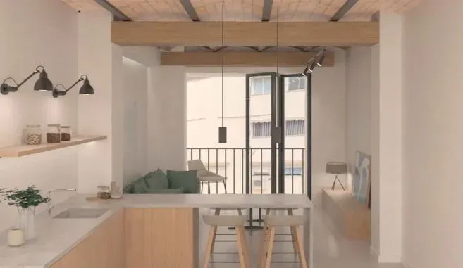 Una cocina con muebles de madera, un fregadero, una mesa y un balcón.