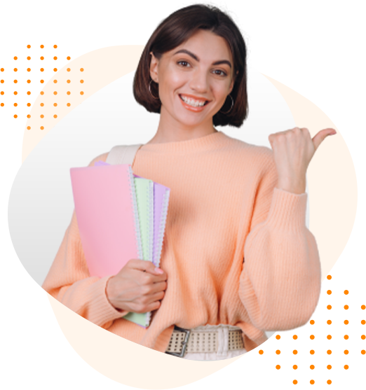 A woman in an orange sweater is holding a stack of books and giving a thumbs up.