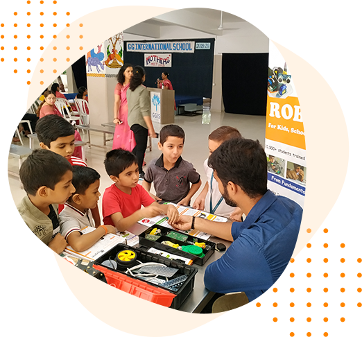 Students learning robotics with an instructor at a Mechatron Robotics centre