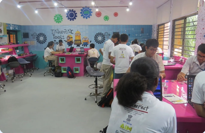 A group of people are sitting at tables in a room.
