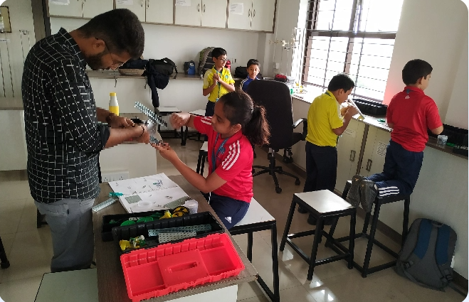 A group of children are working on a project in a lab.