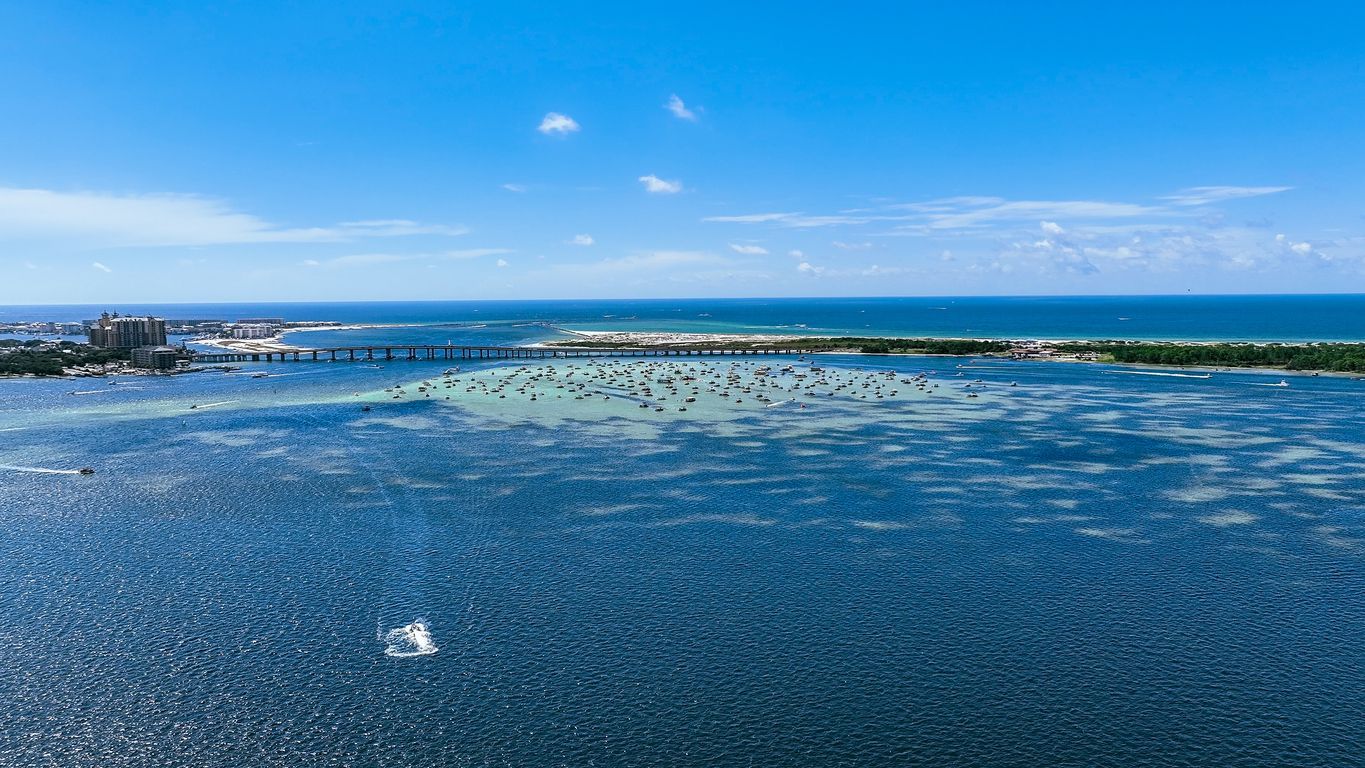 Aerial view of Destin, Florida featuring Crab Island and emerald-green waters