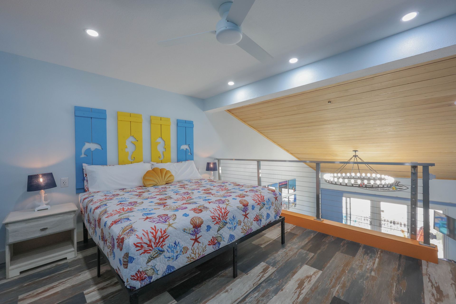 Coastal loft bedroom designed for guest comfort in a vacation rental