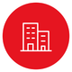 Círculo rojo con el icono de dos edificios delineados en blanco, uno alto y otro bajo.